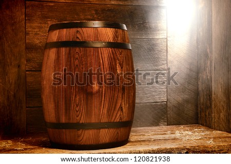 Antique wood traditional whisky barrel or rustic wine keg container on dusty wood boards floor