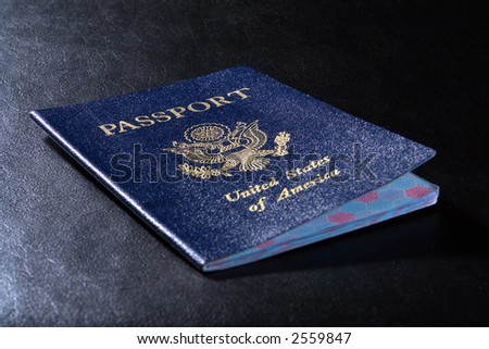American citizenship travel United States US passport on black leather background