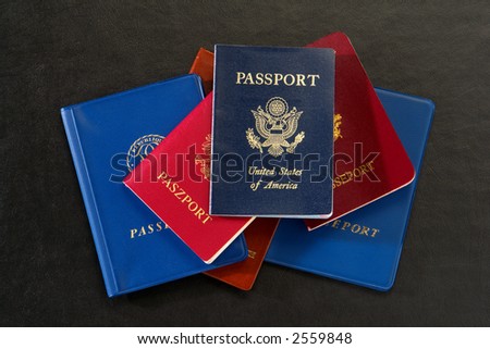 Stack of assorted countries passports with American citizenship proof and Europeans official identification documents