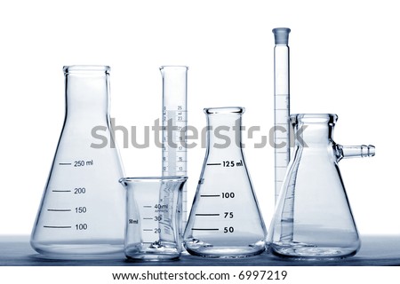 Glass laboratory equipment with conical Erlenmeyer flasks and beaker with scientific cylinder in a science research lab in blue tone over white background (no visible logo or trademark)