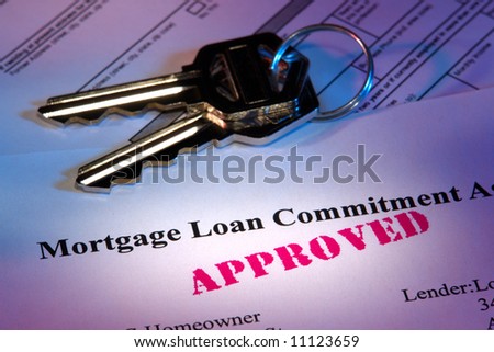 Residential real estate lender home mortgage loan commitment letter with approved stamp imprint and set of house keys