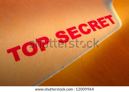 Top secret confidential document inside a manila file folder