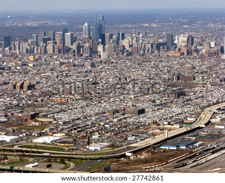 Aerial view of major American city Philadelphia Pennsylvania with Downtown Center City commercial business district and residential South Philly area with highway interstate I-95 in foreground