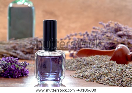 Aromatherapy perfume glass spray bottle with fresh lavender flowers and seeds in an artisan shop