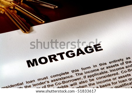 Real estate mortgage commitment document and set of house keys for a loan transaction settlement (fictitious document with authentic legal language)
