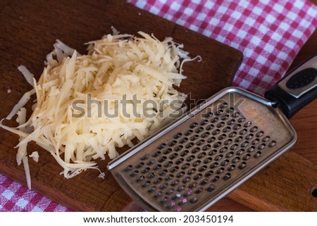 Grated cheese with grater
