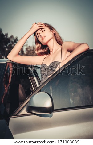 beautiful woman tired after car driving