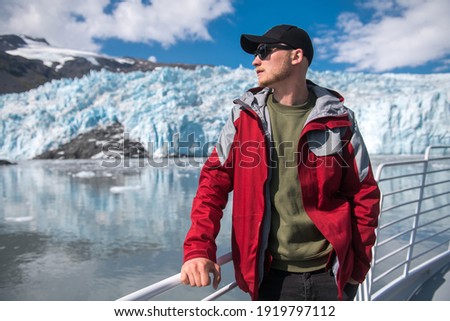 Similar – Image, Stock Photo A man in a hat looks friendly and a little bit melancholic into the camera