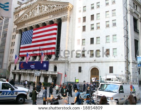 NEW YORK, NY -- SEPTEMBER 30, 2008: The NYPD and News Crews Stand Watch Outside the New York Stock Exchange on September 30, 2008, the day after the record-breaking 777-point drop in the Dow