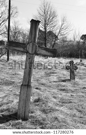 Old wooden grave cross in David-town, Belarus. Black and white