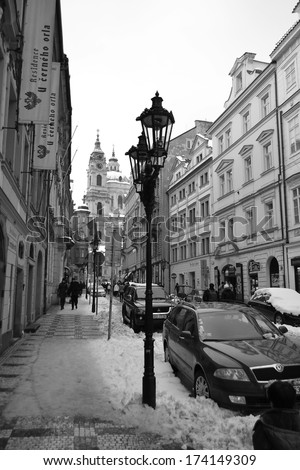 PRAGUE, CZECH REPUBLIC - FEBRUARY 24, 2013: Street in center of Prague at winter. Black and white. Prague - Czech capital. Population - 1.3 million people (2013).