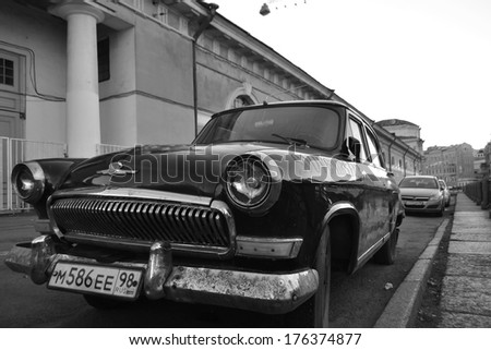 ST.PETERSBURG, RUSSIA - SEPTEMBER 7, 2013: Old soviet car Volga. Black and white. Volga GAZ-21 - Soviet passenger car of the middle class, production of the Gorky Automobile Plant from 1956 to 1970.