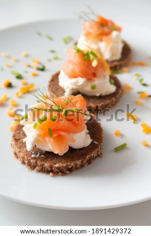 Delicious canapes with smoked salmon and cheese cream  Photo stock © 