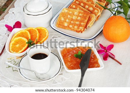 black coffee,waffles and orange marmalade on the table