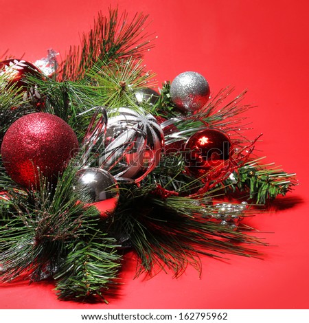christmas decoration red and silver balls on christmas tree branch over red background holiday - Red Silver Christmas Decorations christmas decoration red and silver balls on christmas tree branch over red background holiday - Red Silver Christmas Decorations