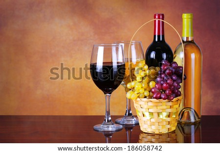 Wine Bottles and Glasses of Wine. Basket of Fresh Grapes