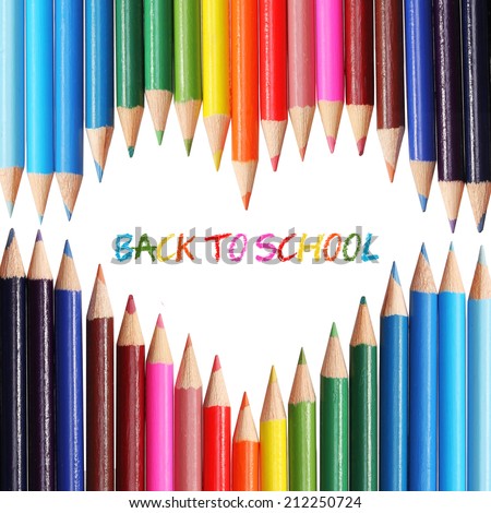 Back to school concept. Colorful pencils arranged as the heart, isolated on white. The words \'Back to School\' written in the heart shape