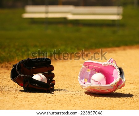 Baseball. Balls in Gloves on Green Grass. Female vs Male. Concept