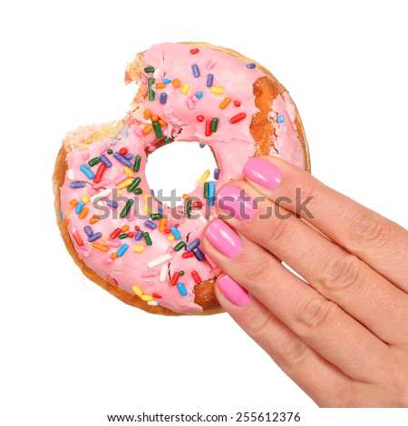 Bitten Donut with Sprinkles in Woman Hand isolated on white