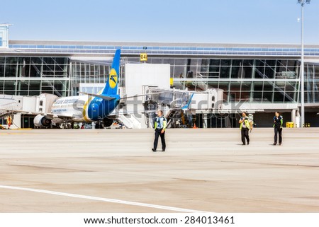 Ukraine, Borispol - MAY 22 : Airport security is on the runway at Borispol International Airport on May 22, 2015 in Borispol, Ukraine