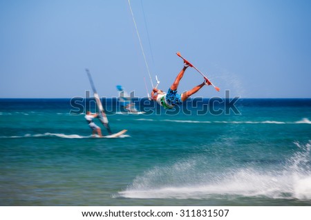 Greece, Rhodes - July 16  Kitesurfer jumping on Prasonisi on July 16, 2014 in Rhodes, Greece