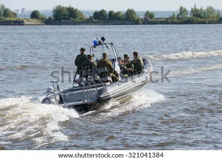 Russia, St. Petersburg, July 15, 2015. Military Navy Training. Navy Paratroopers. boat leaves training place