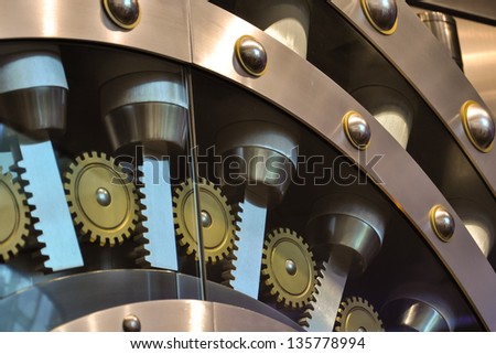 details of a safe door, showing gears and bolts