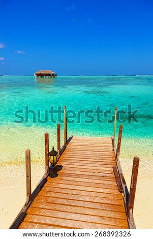 Water bungalow on Maldives island - nature travel background
