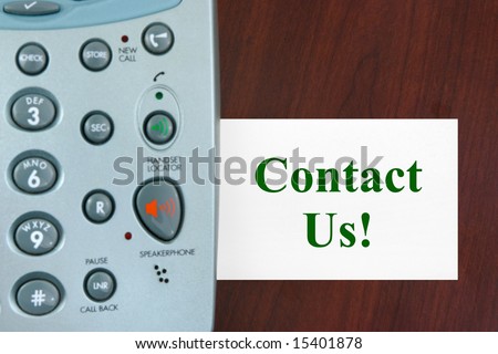 Phone and card Contact Us!, business background