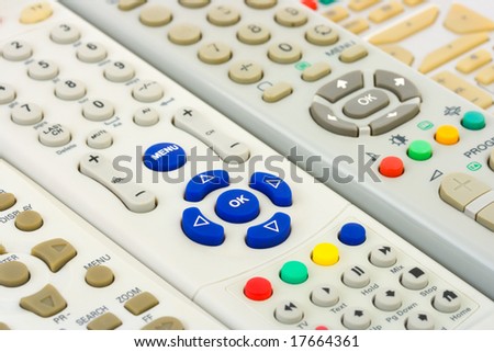 Group of tv remote controls, abstract technology background