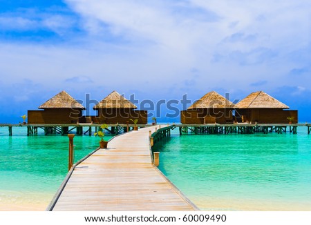 Water bungalows at a tropical island - travel background