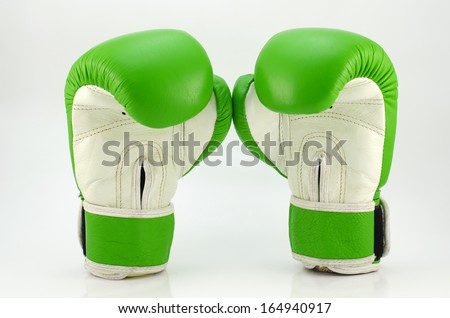 A pair of green boxing gloves on a white background