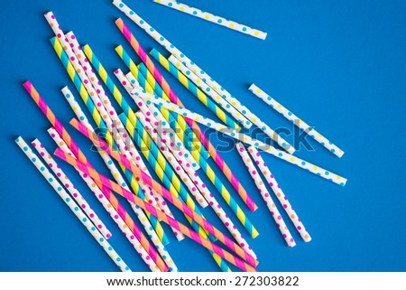 Paper straws on a bright blue background