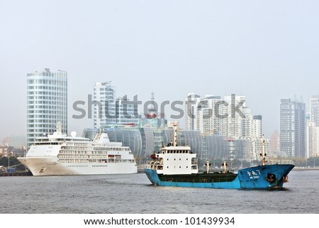 SHANGHAI-NOV. 20, 2010. Coaster on Nov. 20, 2010 in Shanghai. Shanghai port overtook in 2010 Singapore port to become the world\'s busiest container port. Shanghai\'s port handled 29.05 million TEU.