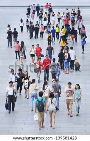 BEIJING-MAY 21. Crowd at Xidan shopping area. Chinas estimated population is 1,338,612,968. 21% of population (145,461,833 male; 128,445,739 female) are 14 years or younger. Beijing, May 21, 2013.