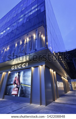 SHANGHAI-JUNE 10. Gucci store at twilight. The Chinese luxury goods market account for 28% of global sales for Swatch, 22%, 18% for Gucci, 14% for Bulgari and 11% for Hermes. Shanghai, June 10, 2013.