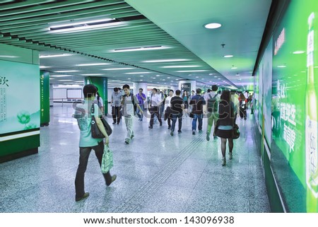 SHANGHAI-JUNE 6. Commuters at subway station. 12 metro lines and 287 stations, with an operating route length of 439 KM, making Shanghai the third longest metro in the world. Shanghai, June 6, 2013.