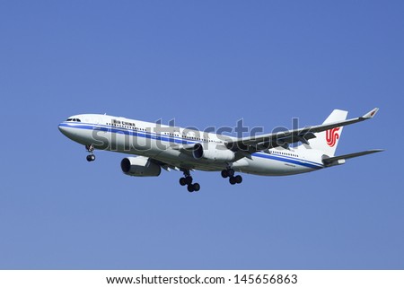 BEIJING-JULY 5. Air China Airbus A330-343X, B-6512 is landing. It is a long-range wide-body twin-engine jet airliner, capacity 300 passengers, range up to 5,450 nautical miles. Beijing, July 5, 2013.