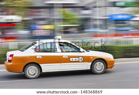 BEIJING-OCT. 28. Taxi in city center. Taxi is a popular and affordable transport mode in Chinese cities. In Beijing, over 70,000 taxis running daily throughout the city. Beijing, Oct 28, 2011.