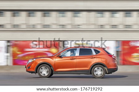 CHANGCHUN, CHINA - JAN. 31, 2014. GS5 SUV on the road. Recently the Guangzhou Auto Trumpchi GS5 1.8T has been launched on the Chinese car market, price starts at 148.800 yuan and ends at 229.800 yuan.