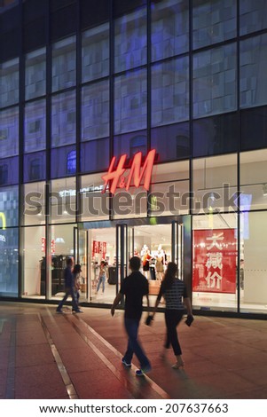 KUNMING-JULY 6, 2014. H&M outlet at night. Hennes & Mauritz is active in 48 markets with a total of 2,776 stores. The company opened its first store in China in 2007, currently it has 134 stores.