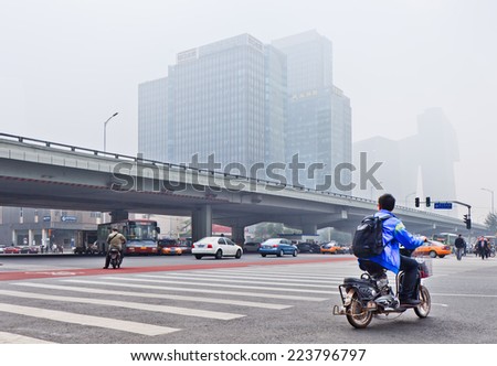 BEIJING-OCT. 11 ,2014. Smog covered city center of Beijing. A concentration of PM2.5, small particles that poses a huge health risk, hit 462 according the U.S. Embassy pollution monitor in Beijing.
