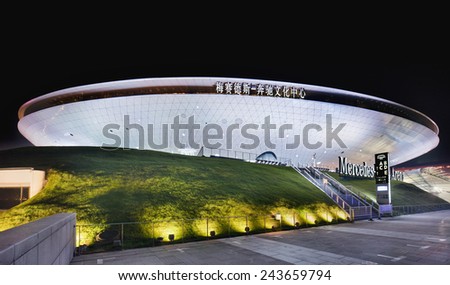 SHANGHAI-DECEMBER 7, 2014. Mercedes-Benz Arena at night. It is the former World Expo Cultural Center, facility which accommodates 18,000 people, hosted the opening ceremony for World Expo in 2010.
