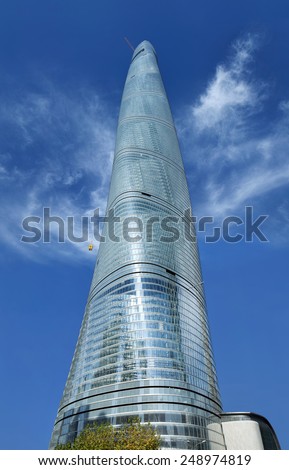 SHANGHAI-DECEMBER 2, 2014. The Shanghai Tower against a blue sky. It is the tallest in China and second in the world. Design by Gensler, Specs: 632m tall, 121 stories, floor area 380,000 sq.meter.