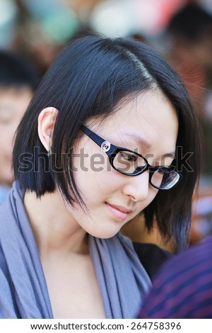 BEIJING-JULY 6, 2008. Fashionable Chinese girl with white skin. White skin is a very long-honed determinant of beauty in China, skin-tone is referred to class, a tanned skin belongs to field workers.