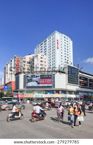 KUNMING-JUNE 30, 2014. Advertisement on a building. China's outdoor advertising market has grown annually more than 23% since 2000, versus 17% for overall ad market and 14% for TV, 16% for newspapers.