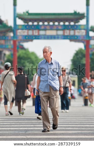 BEIJING-JUNE 9, 2015. Old Chinese man. The elderly population (60 or older) in China is about 128 million, one in every ten people, the world\'s largest. China will have 400 million elderly by 2050.