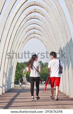 BEIJING-JULY 3, 2015. Two youngsters in a park. According 2010 national census, China\'s unmarried population is huge: about 249 million 18-and-older Chinese are not married (18.6% of population).