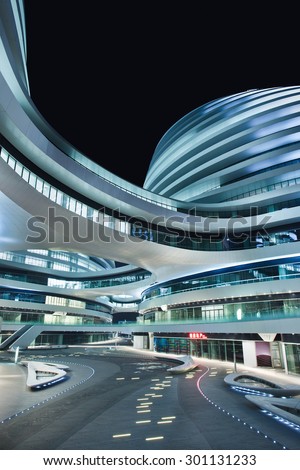 BEIJING-APRIL 2, 2013. SOHO Galaxy office building. SOHO is China\'s largest prime office real-estate developer with 18 properties in Beijing. Galaxy (design Zaha Hadid) is one of its most recent.
