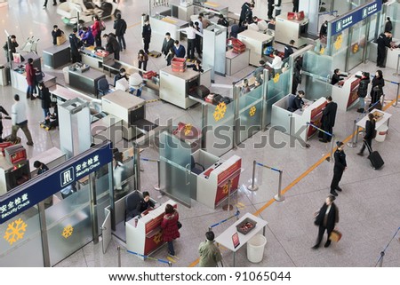 BEIJING - DEC. 16. Security check area at Beijing Capital Airport. The airport registered 488,495 aircraft movements (take-offs + landings), ranked 10th in the world. Beijing, Dec. 16, 2011.
